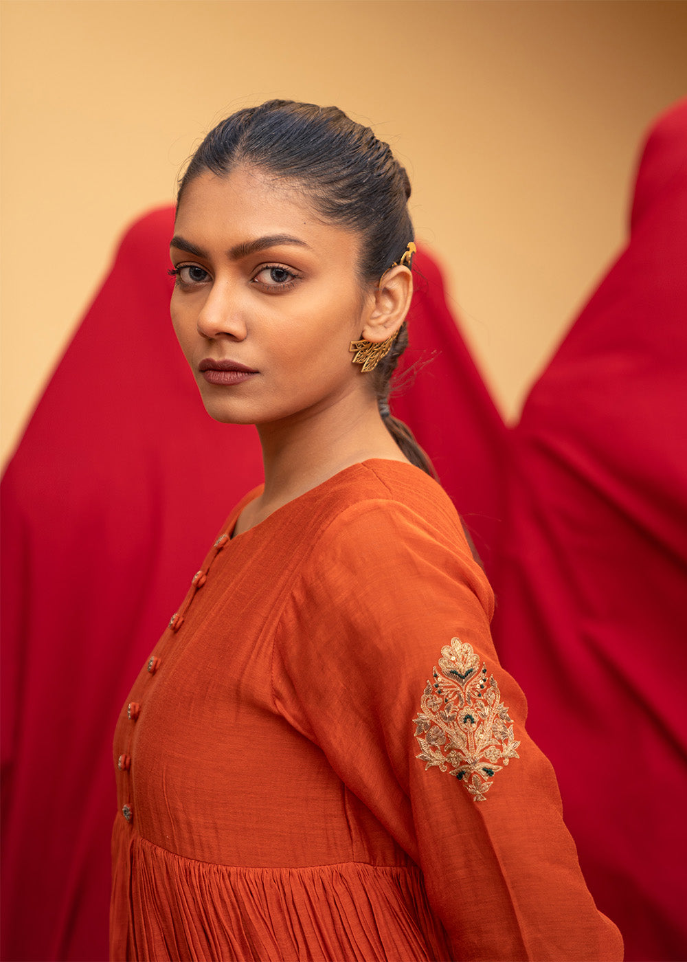 Burnt orange flared suit